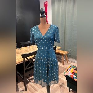 Francesca’s green and faded gold polka dotted feminine dress in medium.